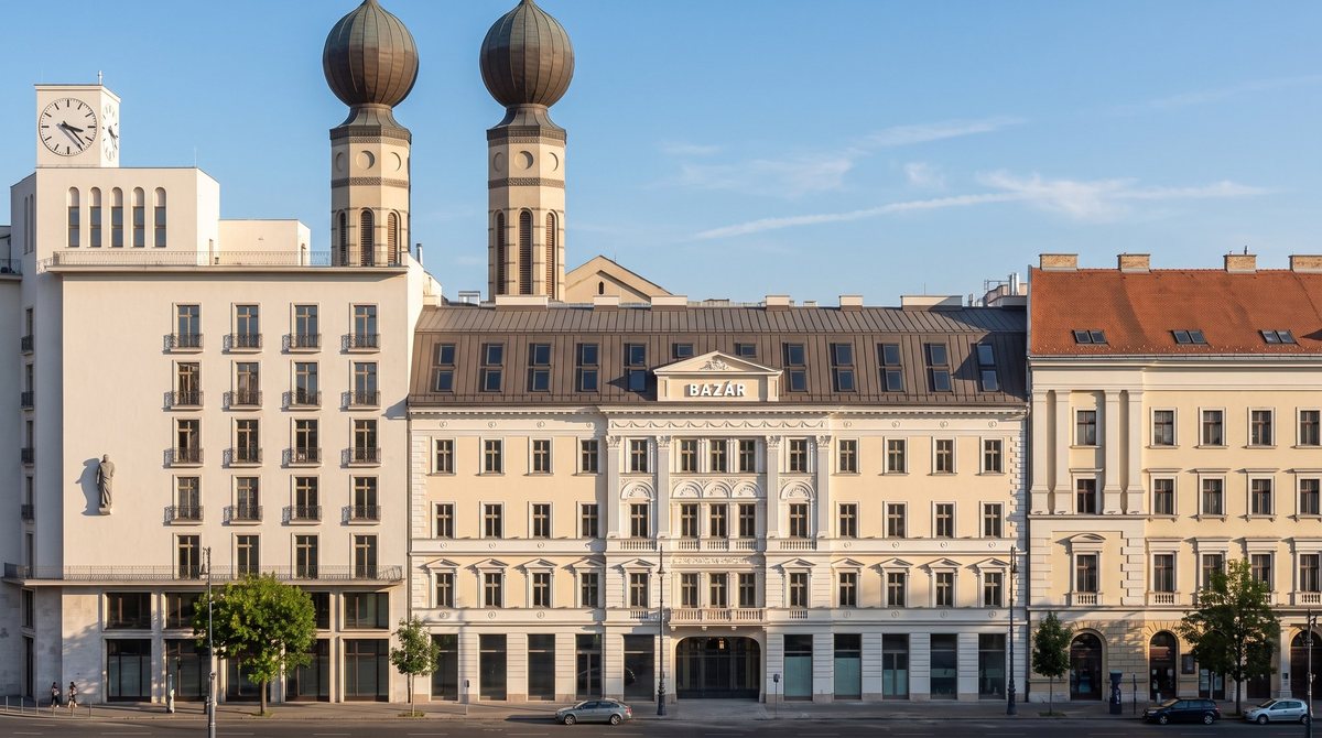 The Rákóczi út main façade with the BAZÁR lettering, the synagogue domes behind